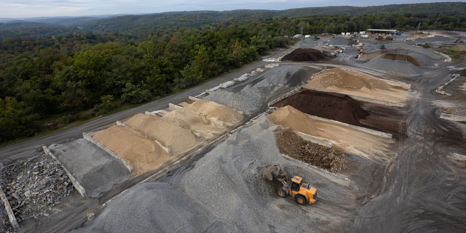 Aerial view of a Laney materials yard with stockpiles of stone, sand, and aggregate