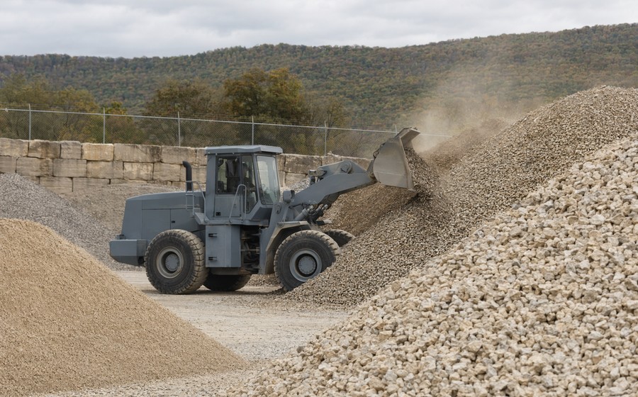 Crushed stone aggregate stockpiles at a Laney materials yard